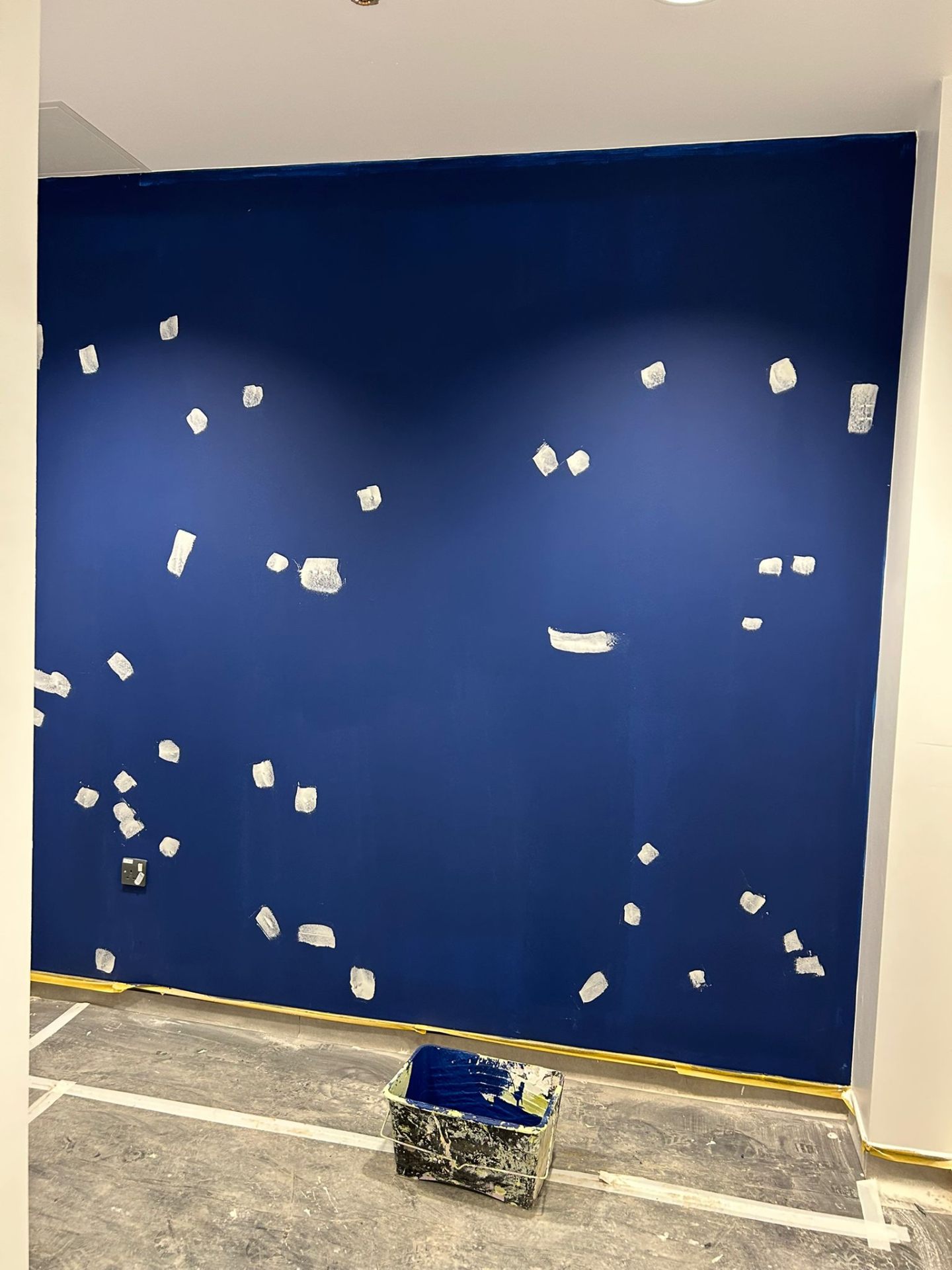 Cobalt blue accent wall, second-coat prep with filler spotting, by Bendrick Painting & Decorating