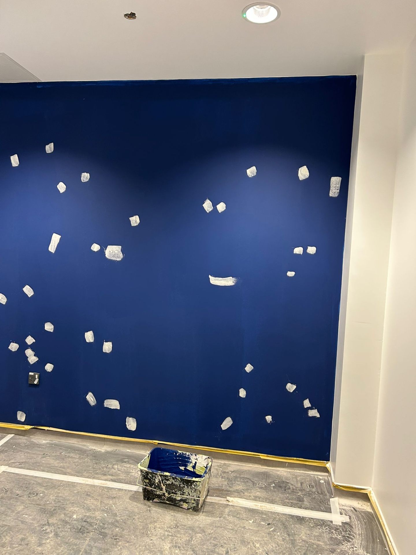 Cobalt blue accent wall, second-coat prep with filler spotting, by Bendrick Painting & Decorating